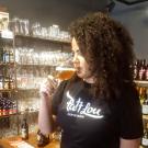 Tapping Potential Scholarship winner Nadhine França tastes a beer 