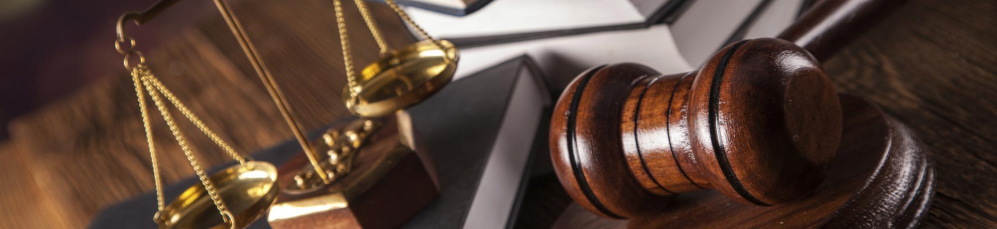 gavel, scales and books on a desk